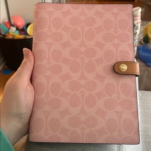 coach powder pink notebook in signature canvas